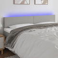 vidaXL Zagłówek do łóżka z LED, jasnoszary, 160x5x78/88 cm, tkanina