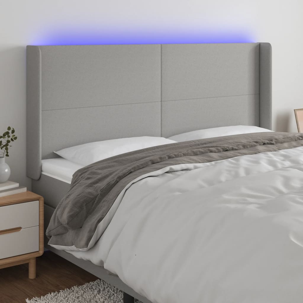 vidaXL Zagłówek do łóżka z LED, jasnoszary, 183x16x118/128 cm, tkanina