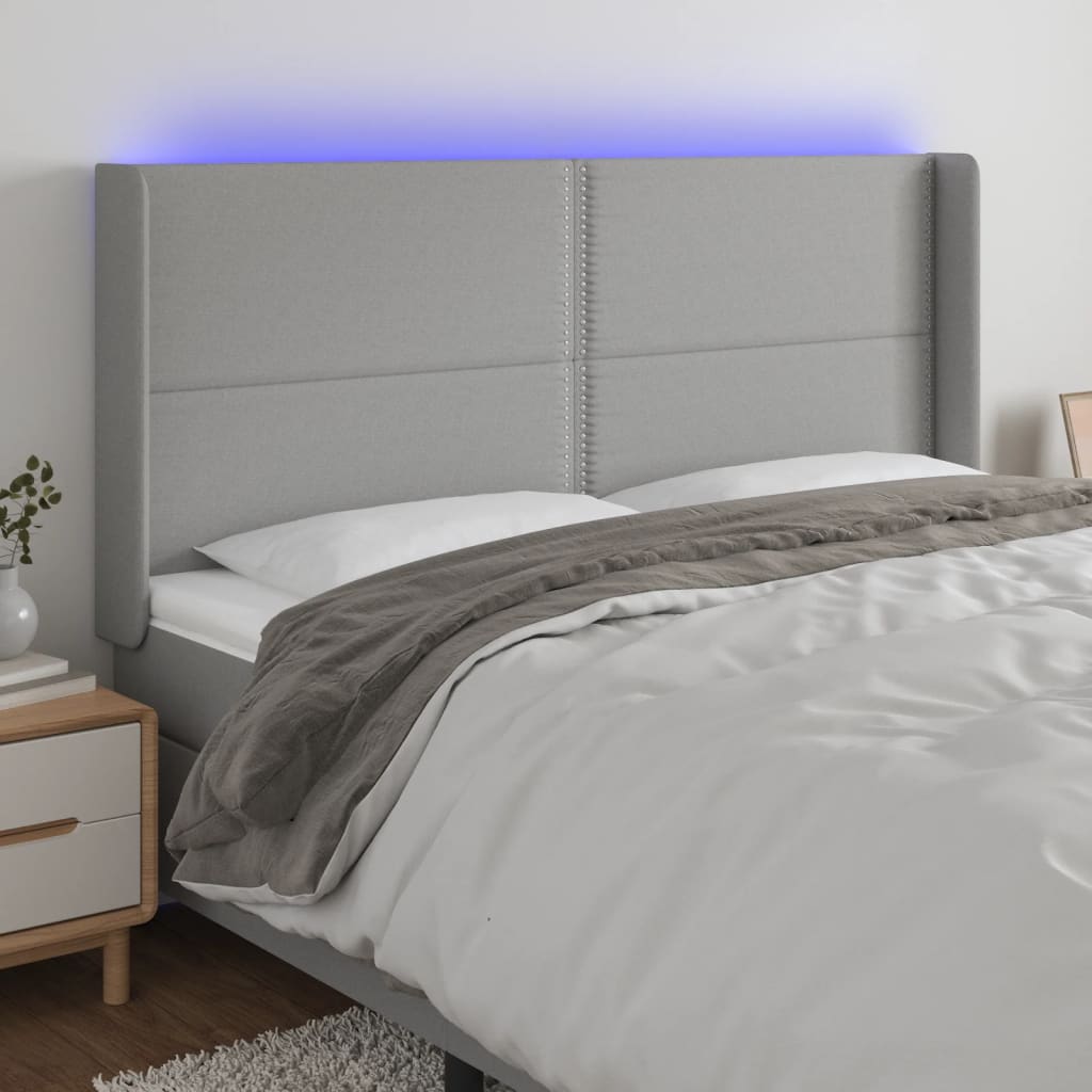 vidaXL Zagłówek do łóżka z LED, jasnoszary, 183x16x118/128 cm, tkanina