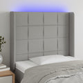 vidaXL Zagłówek do łóżka z LED, jasnoszary, 83x16x118/128 cm, tkanina